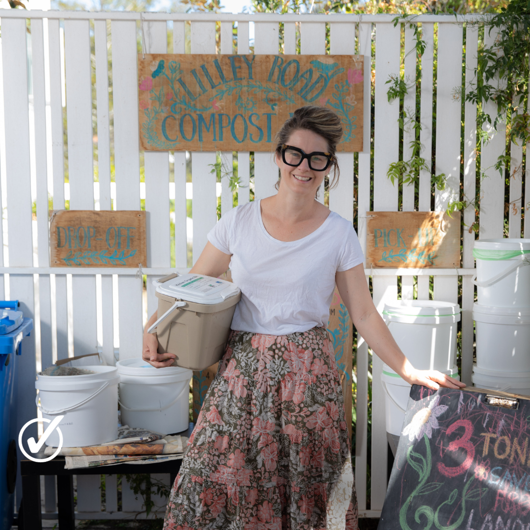 Hannah standing in her composting area