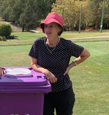 Sue with a bin